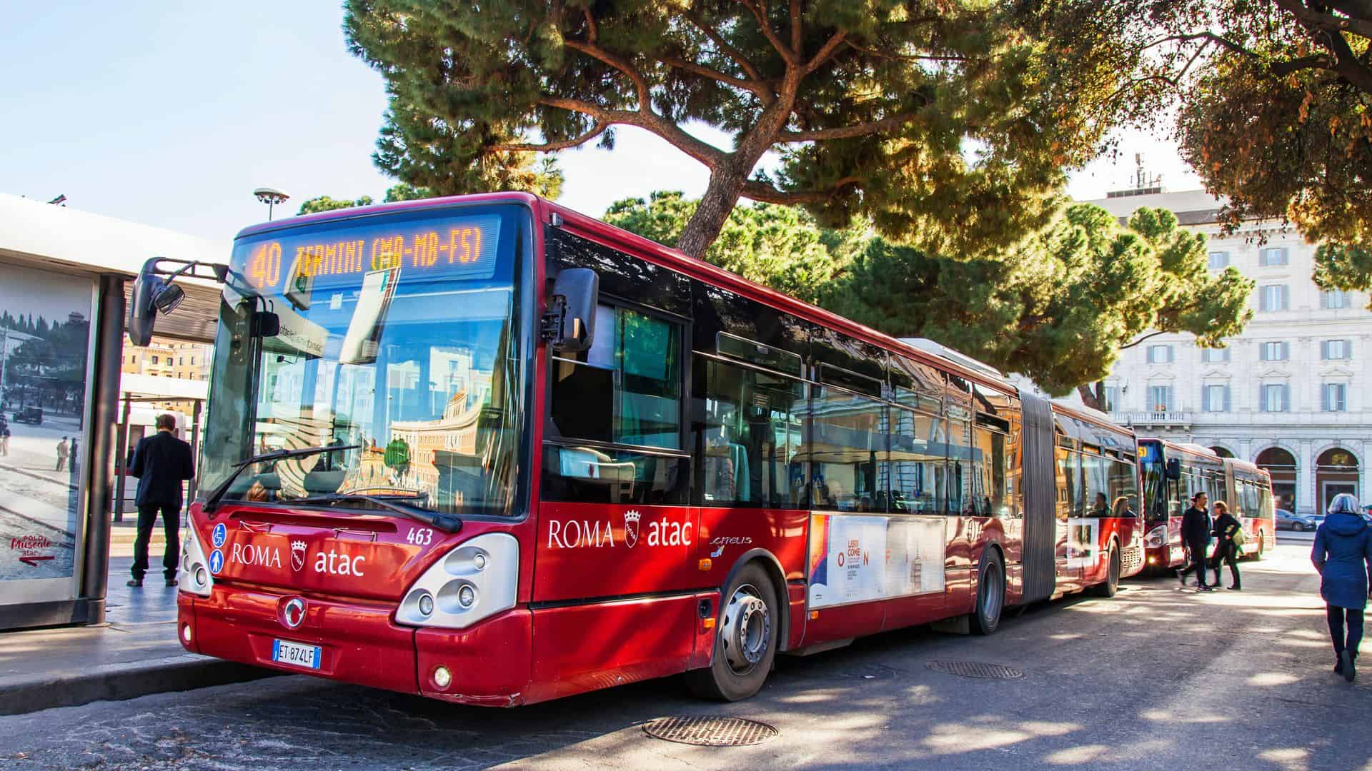 Bus in Rome goes down a beautiful street in a historical part of the city