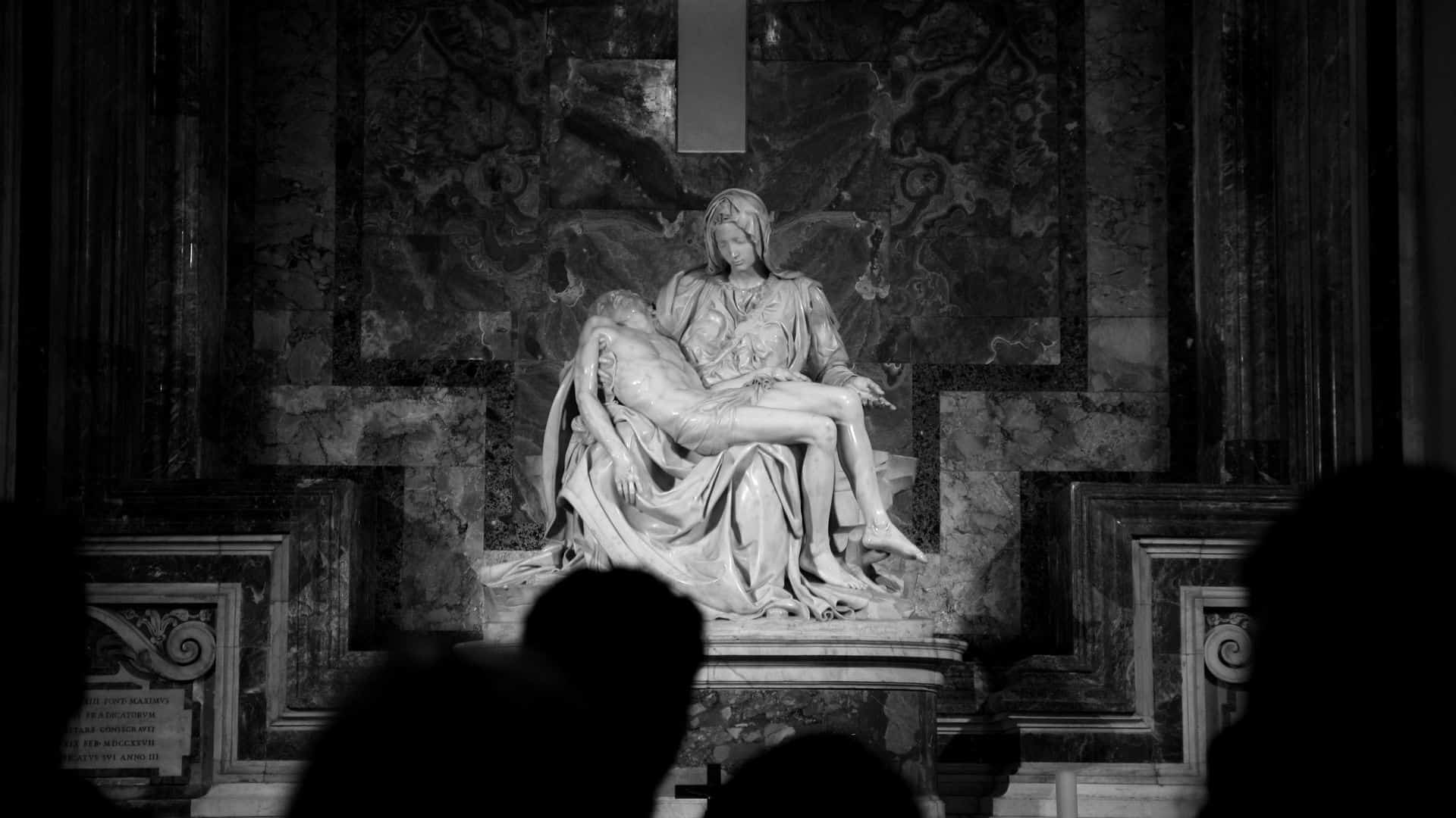 Visitors viewing the Chapel of the Pieta inside St. Peter’s Basilica