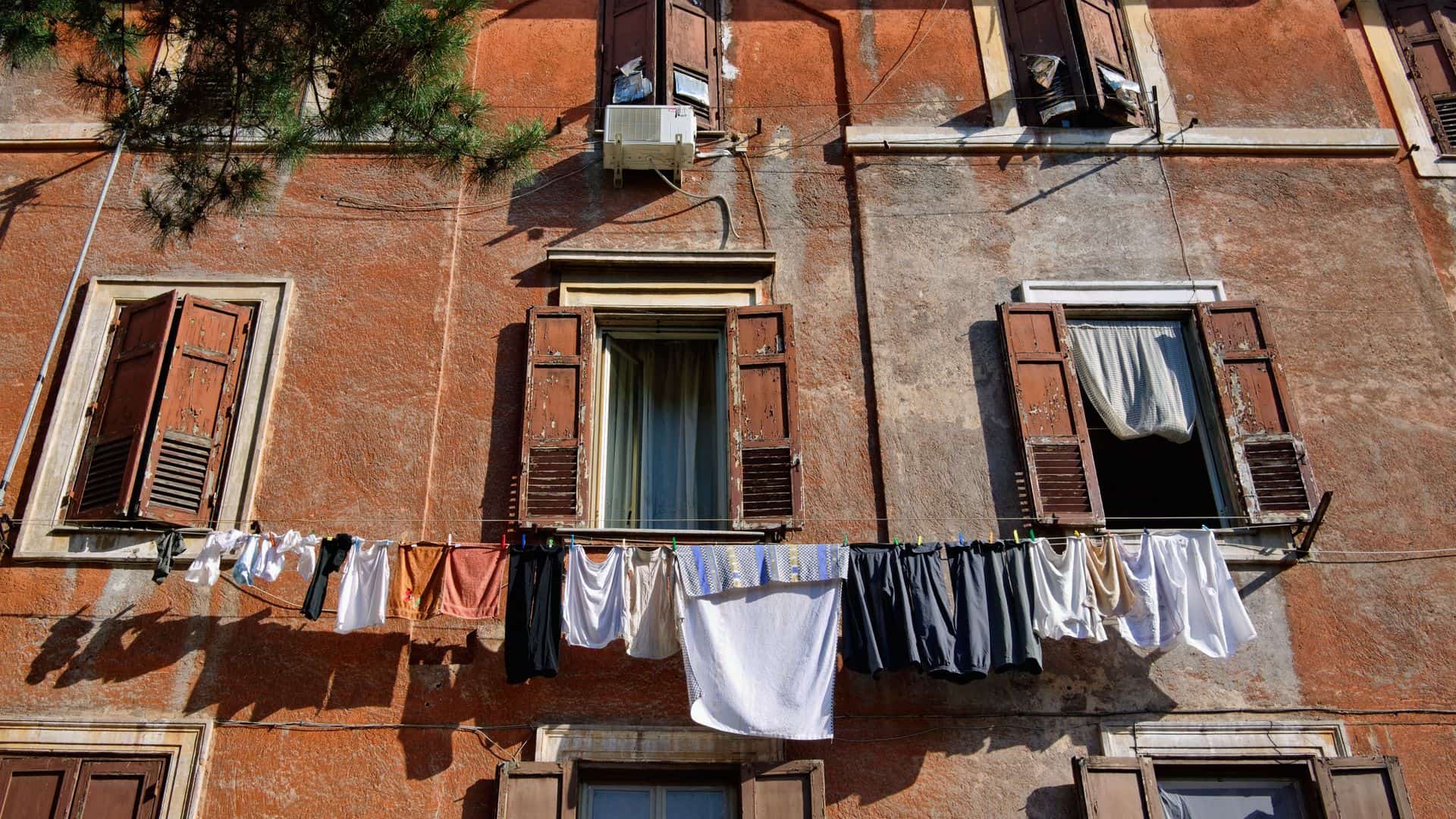 Clothes hanging from a window in a building in Garbatella.