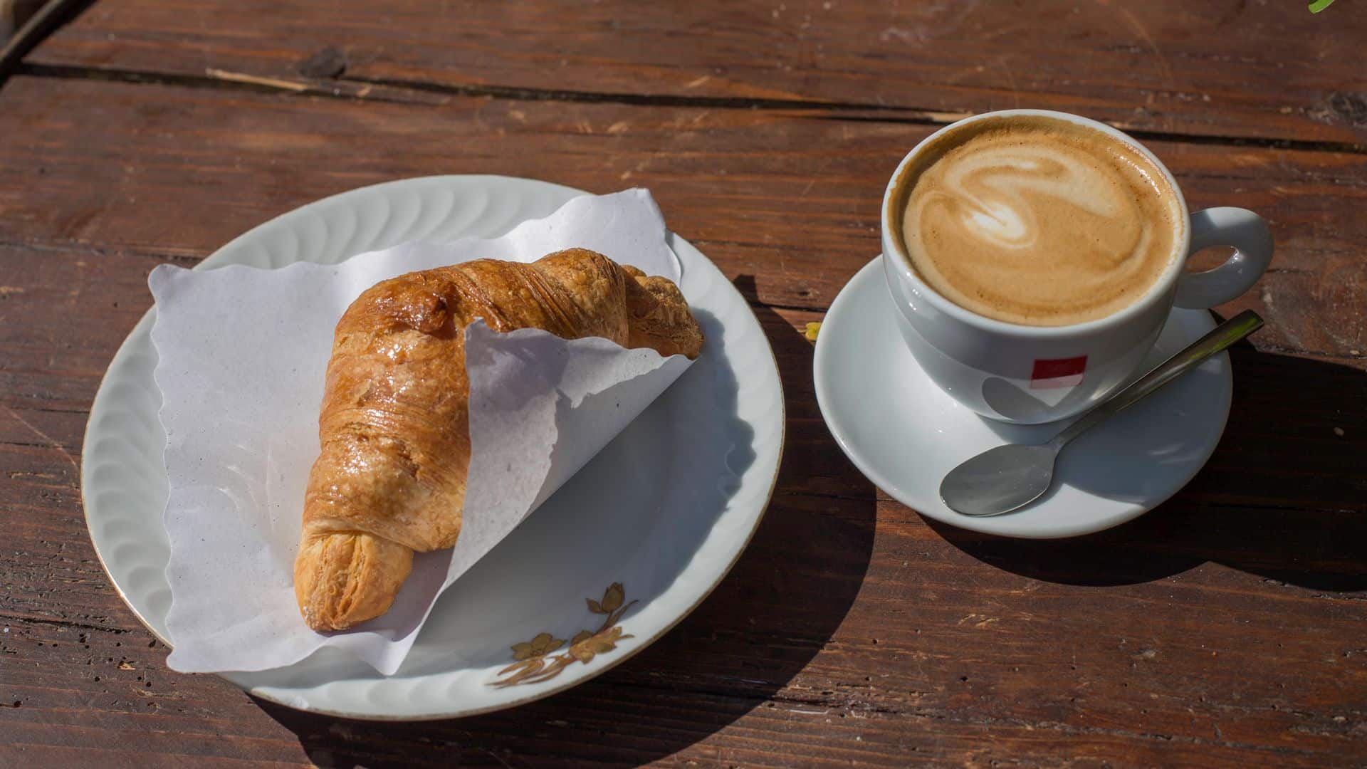 A cappuccino and a croissant.