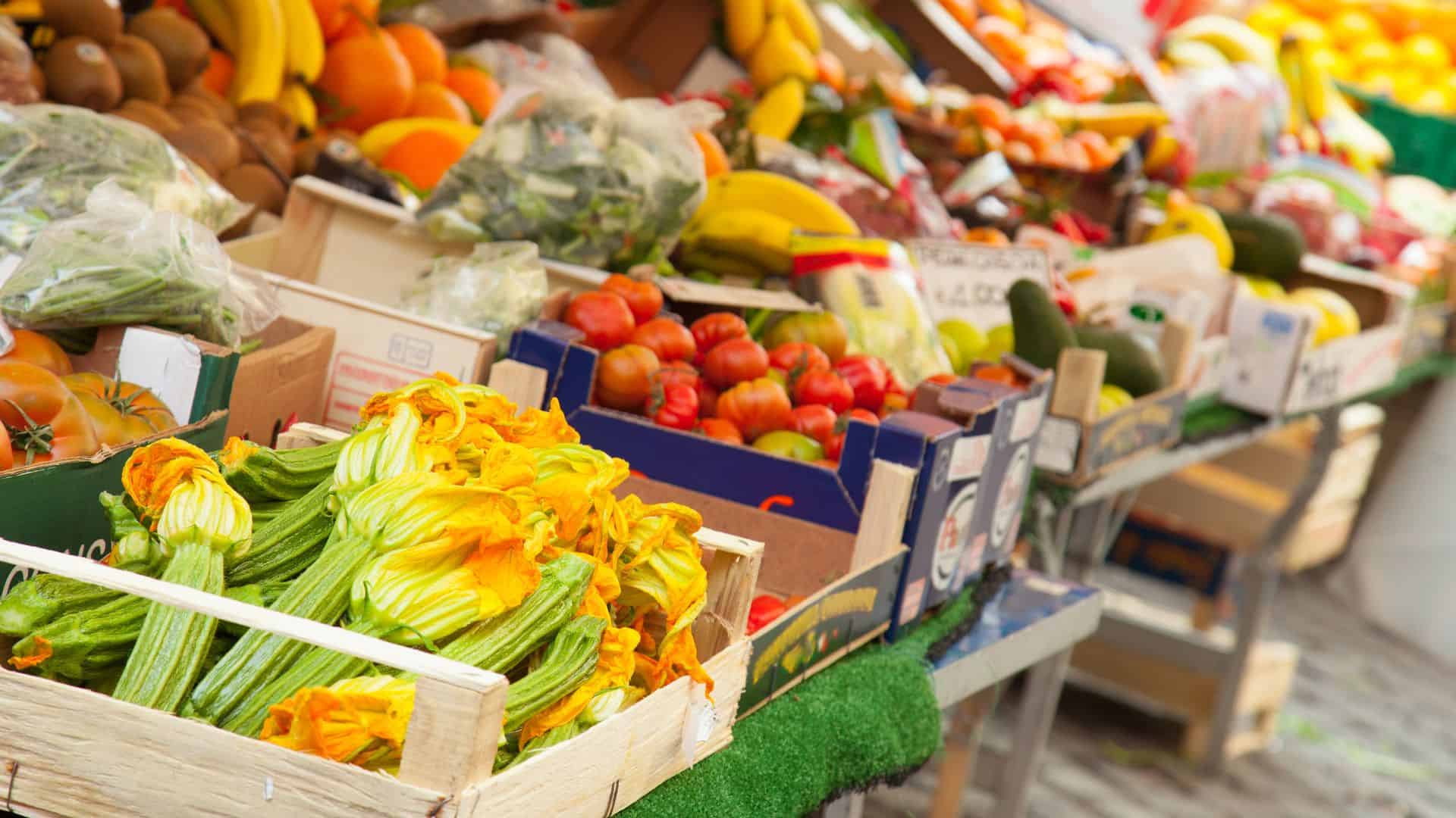 A close-up of a fresh produce stalls in a Roman market.