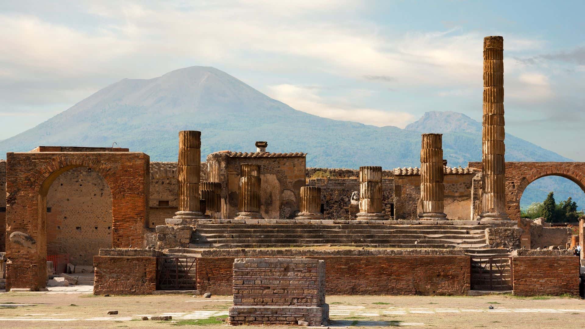 A view of the ruins of Pompeii against the backdrop of Vesuvius.