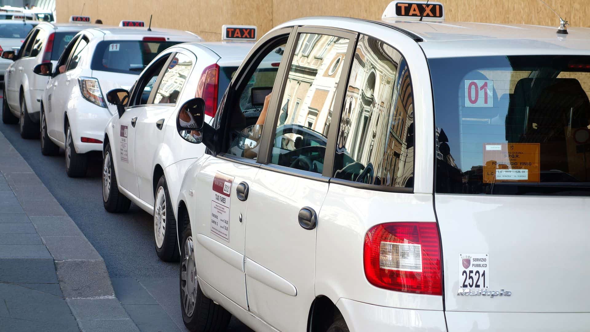 A line of Roman taxis.