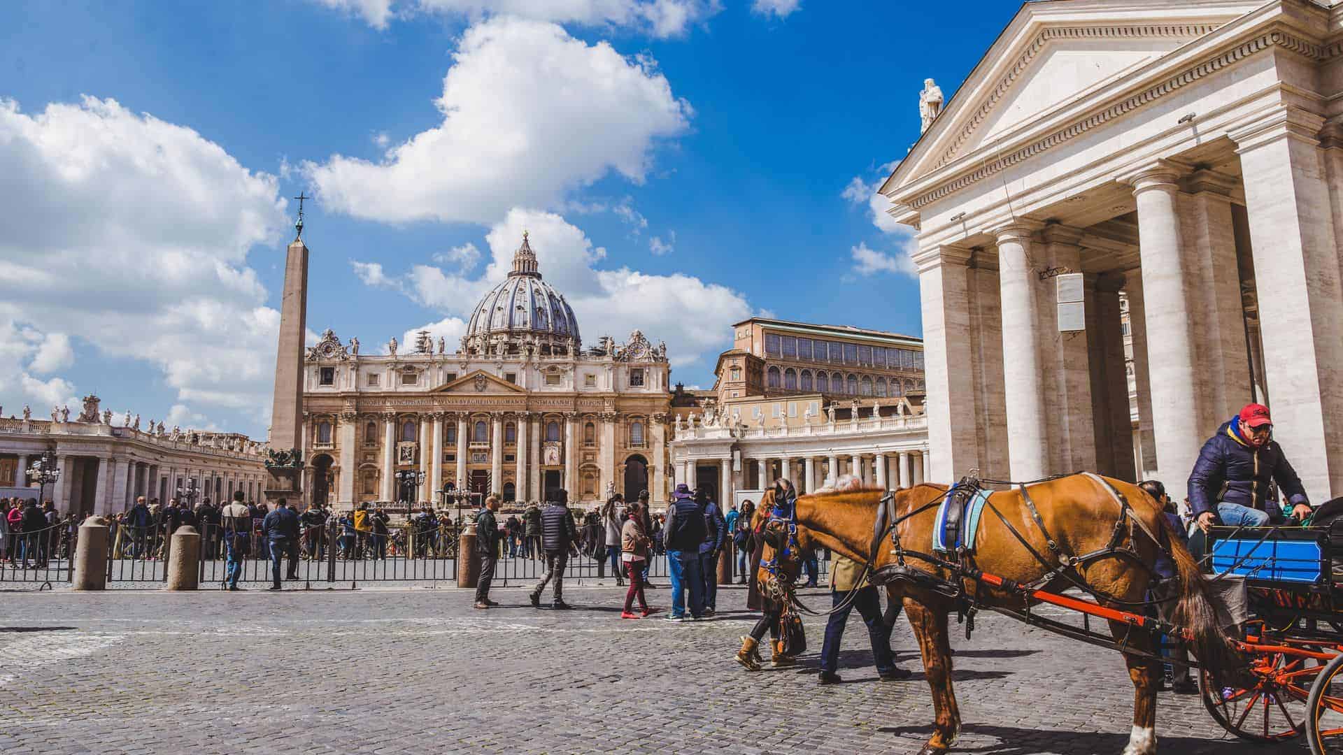 Tourists walking by St. Peter's square