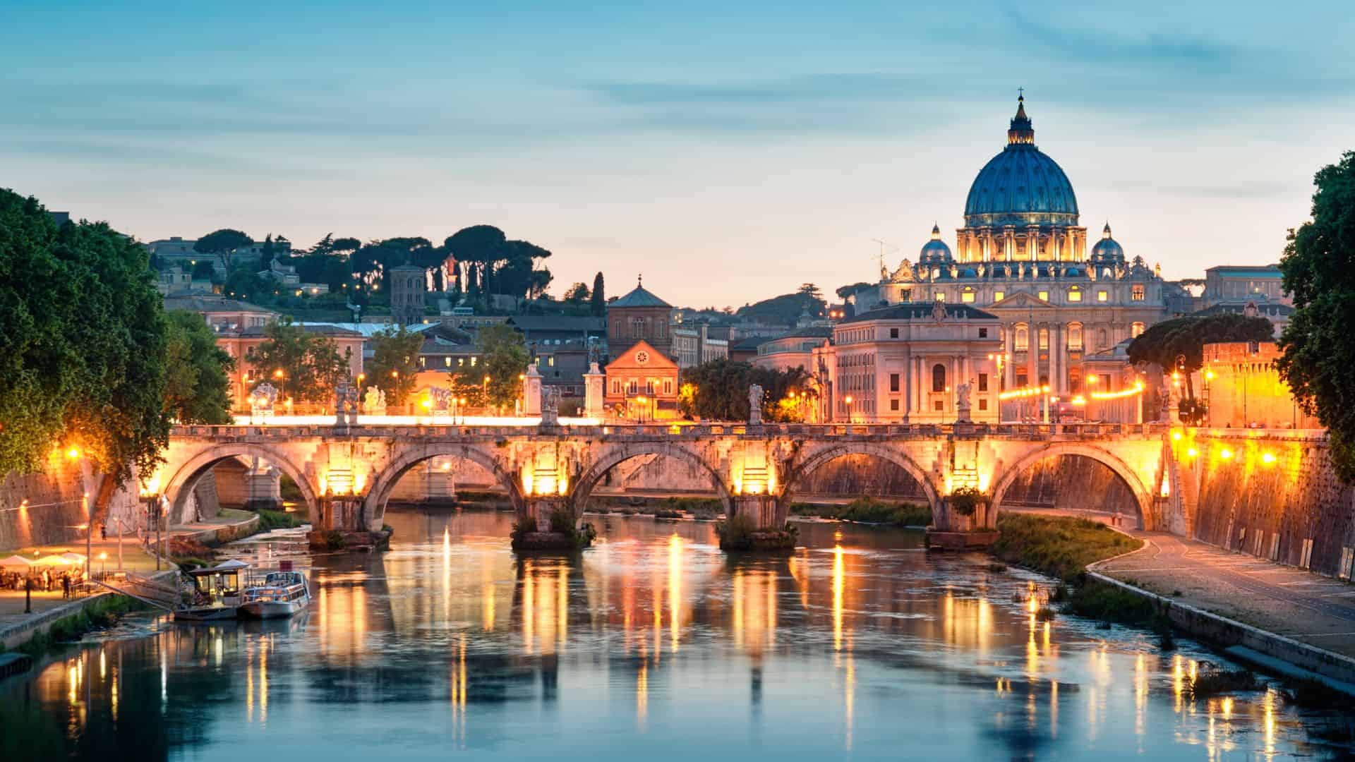 View of the river Tiber and St. Peter's Basilica in Rome and Vatican City.