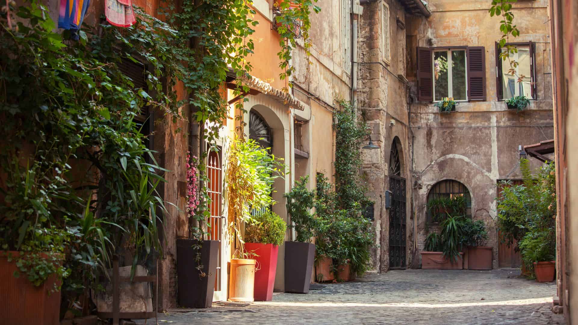 A view of a beautiful plant-filled street in the Trastevere district.